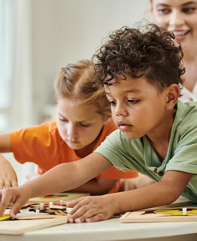 Child engaged in educational play activity