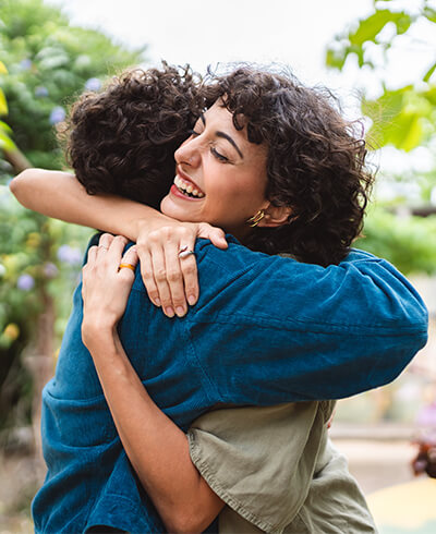 Friends embracing with emotional support