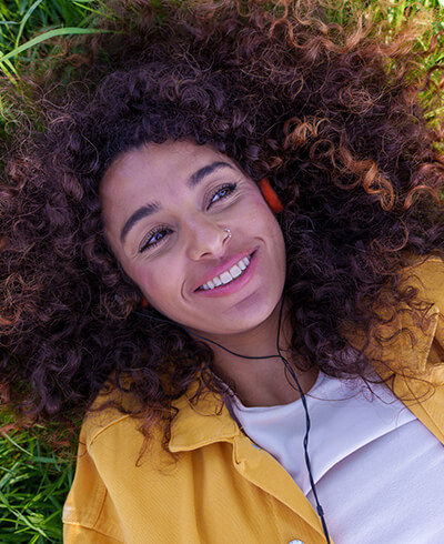 Woman relaxing peacefully in nature after ADHD treatment